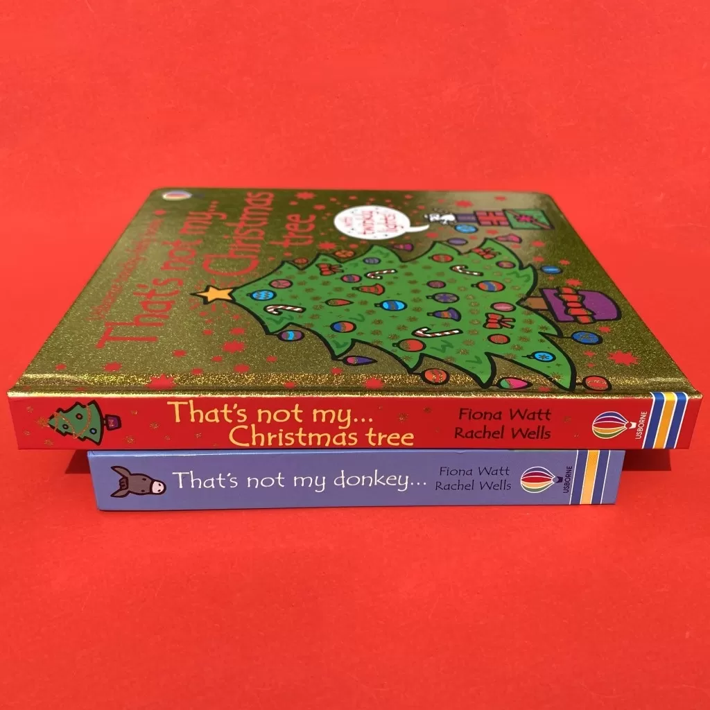 Two books stacked on top of each other: That's Not My Donkey and That's Not My Christmas Tree. The difference in size between the two is visible.